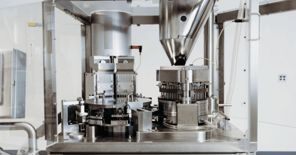 A photo of an Index capsule filling machine. It is the fully automatic capsule filling machine called the K120i