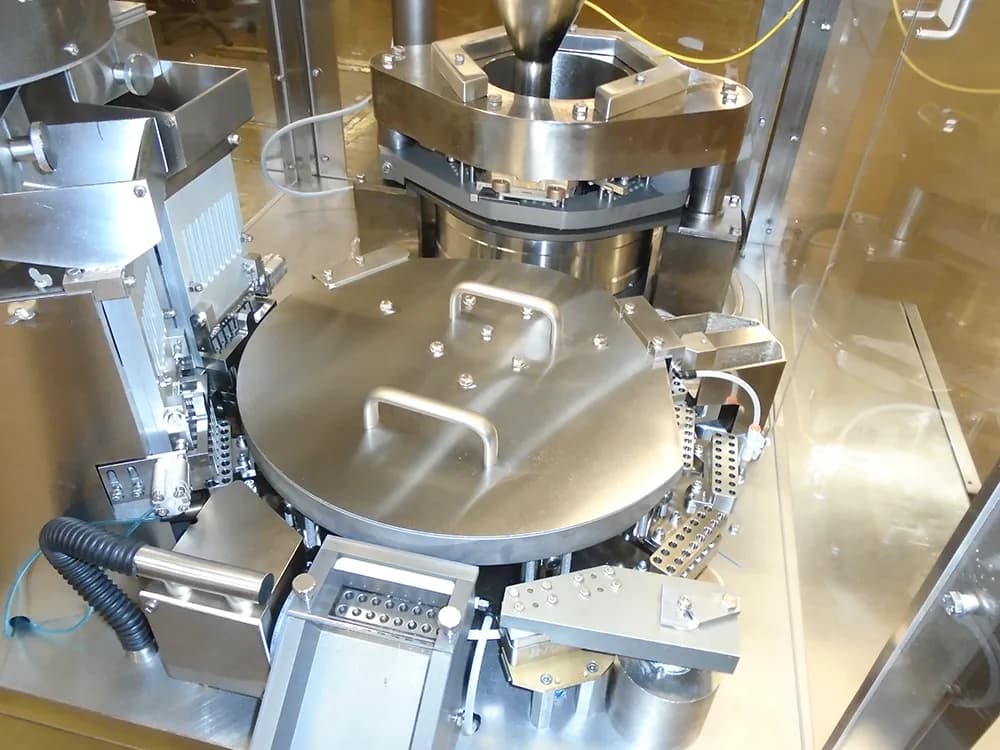 An overhead view of the Index K120i capsule filler.