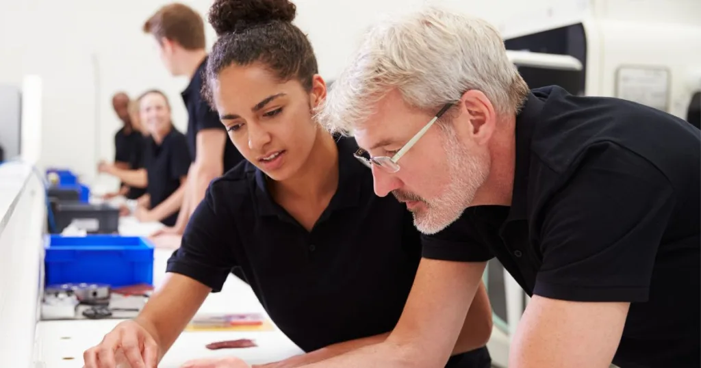 Two people participating in capsule spare parts training.