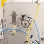 Close up shot of the FW-5050 Floss Winder's hopper filled with bobbins.