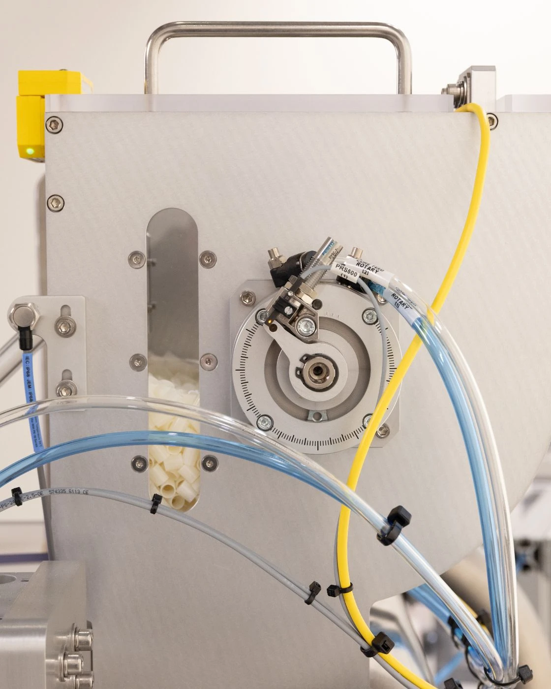 Close up shot of the FW-5050 Floss Winder's hopper filled with bobbins.